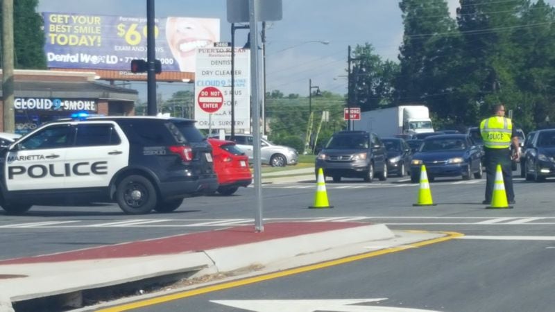 Cobb County police are on the scene of a bank robbery. (Credit: Patrick Lawrence / Twitter)