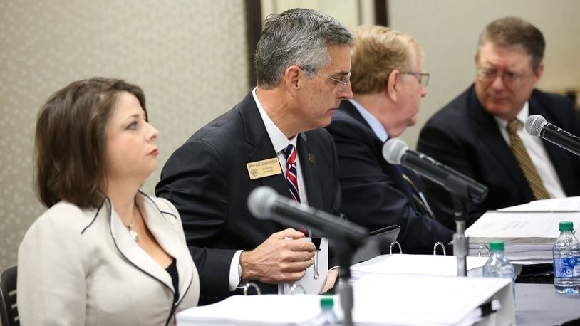 Georgia Secretary of State Brad Raffensperger, center, is shown leading a State Election Board meeting in Athens in March 2020. Georgia's new election law removed Raffensperger from the board, which met for the first time under that statute Wednesday on Zoom. Georgia Secretary of State Brad Raffensperger, center, is shown leading a State Election Board meeting in Athens in March 2020. Georgia's new election law removed Raffensperger from the board, which held its first meeting Wednesday on Zoom since passage of the law.
is no longer a member of the boardmembers prepare for an emergency hearing at the Georgia Center for Continuing Education in Athens, Ga., on Wednesday, March 11, 2020. The hearing will decide whether Athens election officials broke state laws when they switched to paper ballots filled out by hand. [Photo/Austin Steele for the Atlanta Journal Constitution)