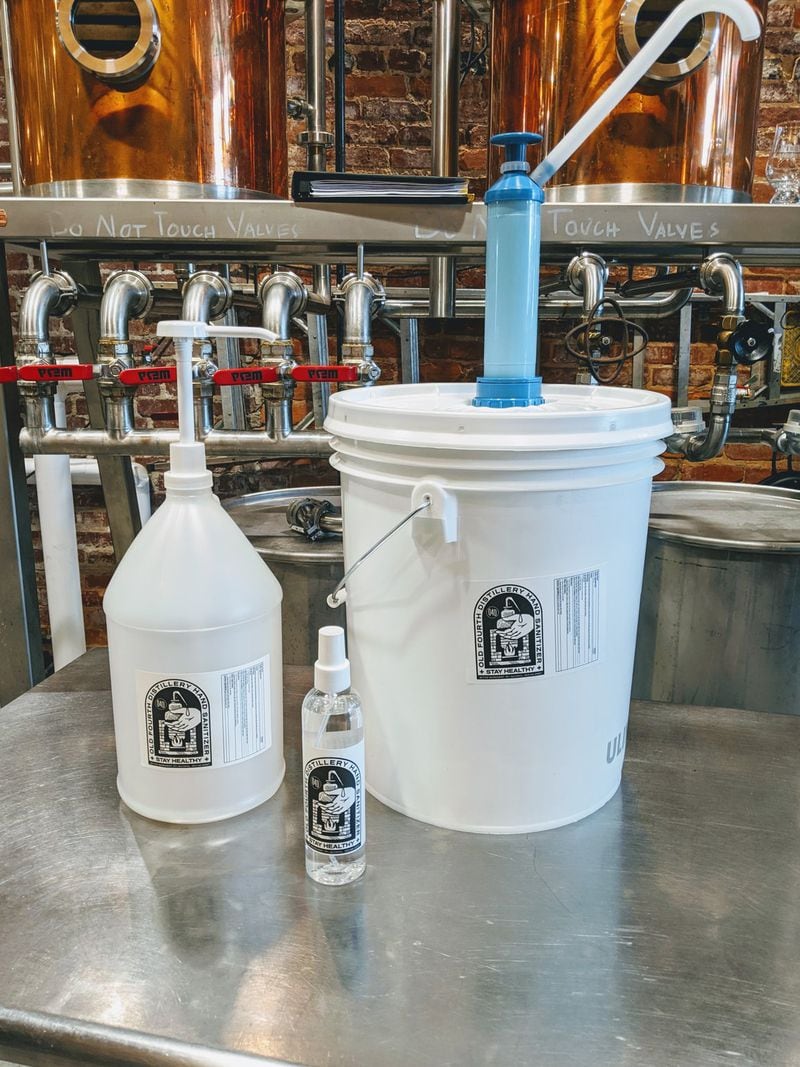Old Fourth Distillery packages its hand sanitizer in sizes ranging from 8-ounce bottles to 5-gallon buckets. CONTRIBUTED BY JEFF MOORE