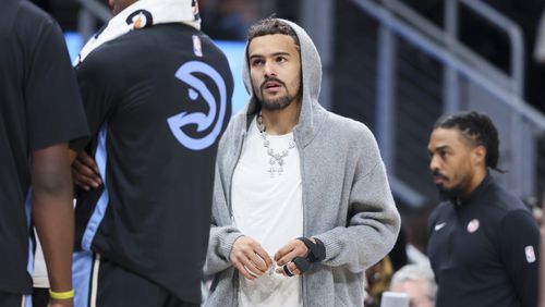 Atlanta Hawks guard Trae Young is shown injured on the bench during a Hawks’ time out during the first half against the Boston Celtics at State Farm Arena, Monday, March 25, 2024, in Atlanta. (Jason Getz / jason.getz@ajc.com)