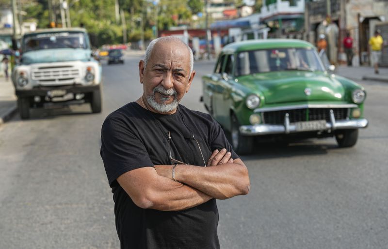 Cuban writer Leonardo Padura poses for a portrait in the street in Havana, Cuba, Wednesday, April 10, 2024. Padura has managed to turn his series of detective novels into a social and political chronicle of Cuba, especially his native Havana. (AP Photo/Ramon Espinosa)