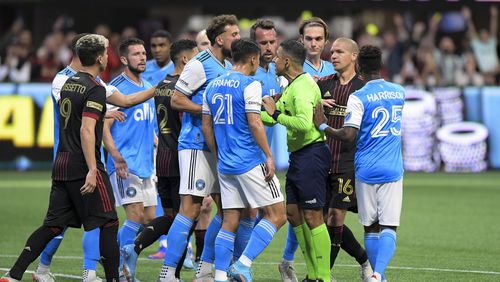 Charlotte FC and Atlanta United players argue after a call during an MLS game Sunday in Atlanta. (Daniel Varnado/For The Atlanta Journal-Constitution)