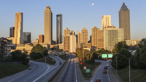 The Jackson Street Bridge Monday, Oct. 17, 2016 as the super moon set over the Atlanta skyline. The Metro Atlanta Chamber and some of its biggest corporate names plan to announce a task force Thursday to sell the region as a tech capital for the Internet of Things.. JOHN SPINK /JSPINK@AJC.COM
