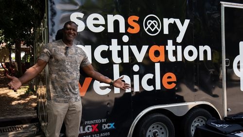 Dominique Wilkins in front of the Sensory Activation Vehicle. 
(Courtesy of KultureCity)