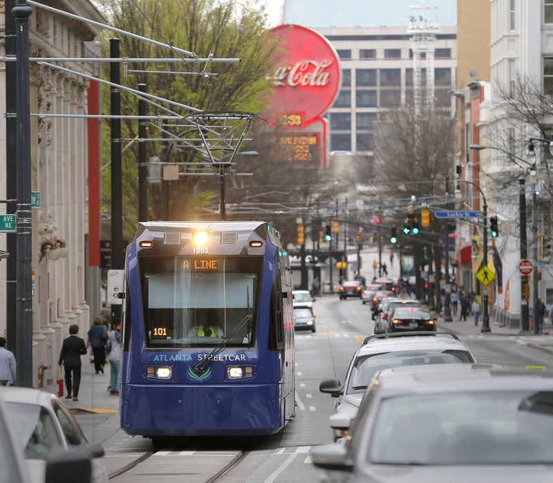 The Atlanta streetcar makes it’s way up Peachtree Street. (BOB ANDRES /BANDRES@AJC.COM)