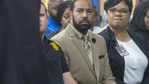 Wynbrooke Elementary School principal Jermain Sumler-Faison (right) and Sean Tartt (center), DeKalb County Region-3 Superintendent, listen to a speaker during an information session at Wynbrooke Elementary School in Stone Mountain, Tuesday, April 30, 2019. The DeKalb County Schools Police Department has a warrant out for a juvenile suspect who is accused of firing a pellet gun at students while playing on a playground on the Wynbrooke Elementary School campus last week. (ALYSSA POINTER/ALYSSA.POINTER@AJC.COM)