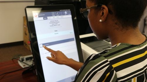 Georgia’s new voting machines by Dominion Voting Systems were demonstrated at the Secretary of State’s Office on Tuesday, Aug. 6, 2019. Voters will make their choices on touchscreens, which are connected to computers that will print out paper ballots for tabulation. Photo credit: Georgia Secretary of State