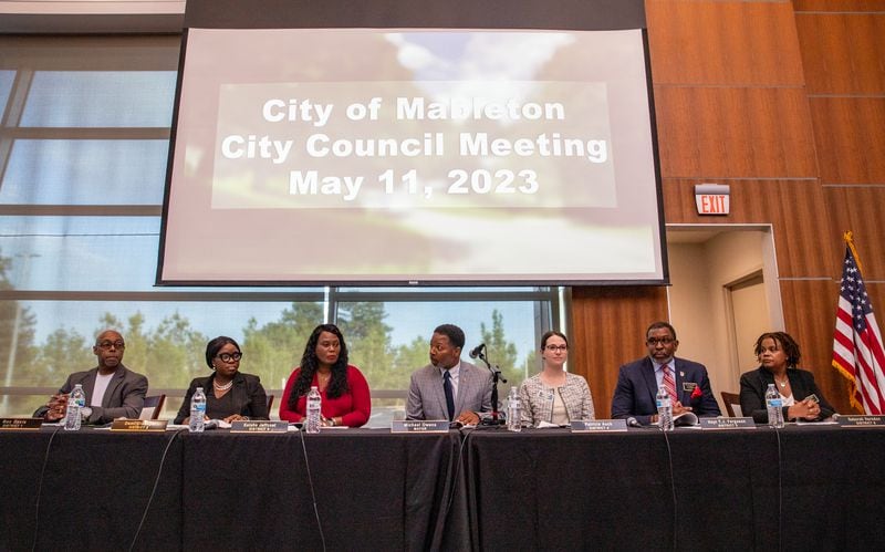 The first Mableton City Council Meeting takes place Thursday, May 11, 2023, at the Riverside Epicenter in Austell.  City council members include Ron Davis, from left, Dami Oladapo, Keisha Jeffcoat, Mayor Michael Owens, Patricia Auch, T.J. Ferguson and Debora Herndon.  (Jenni Girtman for The Atlanta Journal-Constitution)