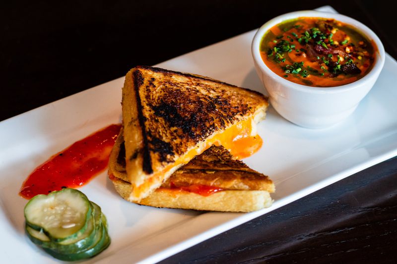 Irby’s Tavern in Buckhead serves several comfort food classics like this pairing of grilled cheese sandwich and tomato soup. CONTRIBUTED BY HENRI HOLLIS