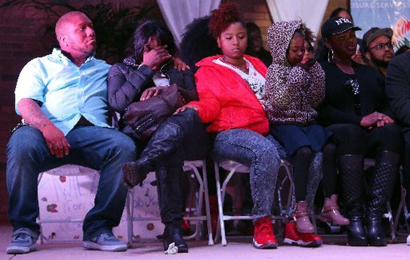 Members of Bobby Brown's family at the vigil. Leolah is seated at the far right. AJC photo by Ben Gray