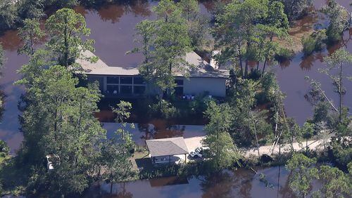 A home on St. Simons Island is surrounded by water following Hurricane Irma on Tuesday, September 12, 2017, on the Georgia coast.    Curtis Compton/ccompton@ajc.com
