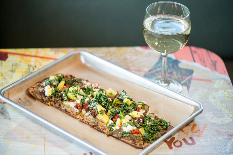  Clarksville Flatbread with brisket, pineapple and kale slaw. Photo credit- Mia Yakel.