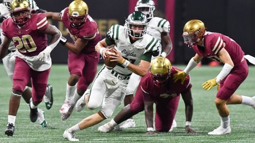 Collins Hill quarterback Sam Horn (21) runs with the ball against Brookwood during the 2021 Corky Kell Classic Saturday, Aug. 21, 2021, at Mercedes-Benz Stadium in Atlanta. Horn rushed for 44 yards and a score in addition to 31-of-44 passing for 402 yards and three touchdowns. (Hyosub Shin / Hyosub.Shin@ajc.com)