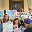 Pro-Choice and Pro-Life demonstrators display their signs over the "heartbeat bill" during the 35th legislative day at the Georgia State Capitol building in downtown Atlanta, Friday, March 22, 2019. According to new statistics from the Association of American Medical Colleges, students graduating from U.S. medical schools were less likely to apply this year for residency positions in states with abortion bans and other significant abortion restrictions. (AJC File photo)