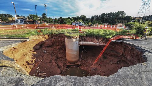 Two sinkholes opened on Venture Drive near Gwinnett Place Mall due to a leaking drainage pipe, seen in this June 22, 2018 photo.