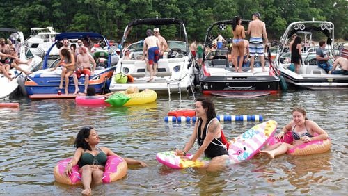 May 27, 2017 Buford - (Foreground from left) Ananya Banerjee, Mel Case and Darby Ford enjoy the fun and sun at Sunset Cove on Lake Lanier on Saturday, May 27, 2017. HYOSUB SHIN / HSHIN@AJC.COM
