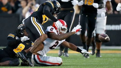 Georgia Bulldogs running back Kendall Milton (2) fumbles the ball during a run in the first quarter against the Missouri Tigers in a NCAA Football game at Faurot Field at Memorial Stadium, Saturday, October 1, 2022, in Columbia, Mo. (Jason Getz / Jason.Getz@ajc.com)