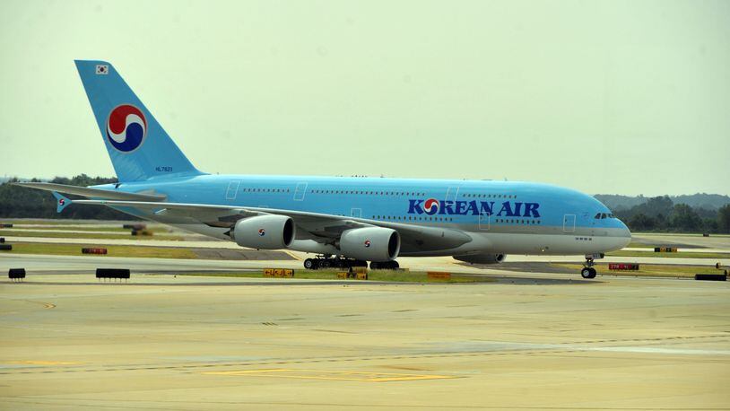 The plane arrives from Seoul Friday morning. Hartsfield-Jackson International Airport and City of Atlanta dignitaries as well as Korean Air officials celebrated the arrival of Korean Air's Airbus A380, the world's largest passenger aircraft, with a ribbon-cutting ceremony and a water cannon salute Friday, September 6, 2013. Following the ceremony, guests were invited to an in-flight tour of airbus A380. Airbus A380 highlights include an exclusive upstairs prestige class, a duty-free showcase and three bars. The plane has seating for 407 passengers. Korean Air will operate the Airbus A380 between Atlanta and Asia on Wednesdays, Fridays and Sundays. The airline will start daily A380 service to Asia in October. KENT D. JOHNSON / KDJOHNSON@AJC.COM