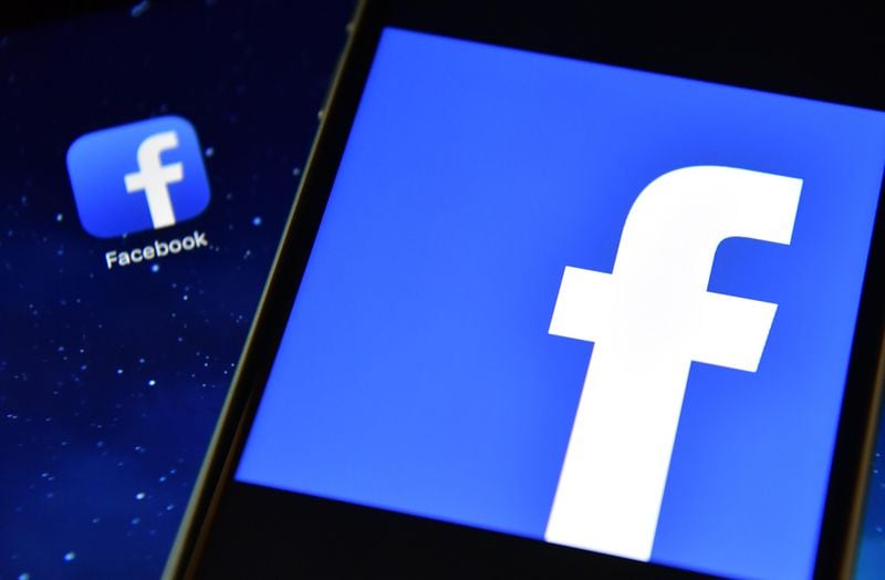 FILE PHOTO: The Facebook app logo is displayed on an iPad next to a picture of the Facebook logo on an iPhone on August 3, 2016 in London, England.  (Photo by Carl Court/Getty Images)