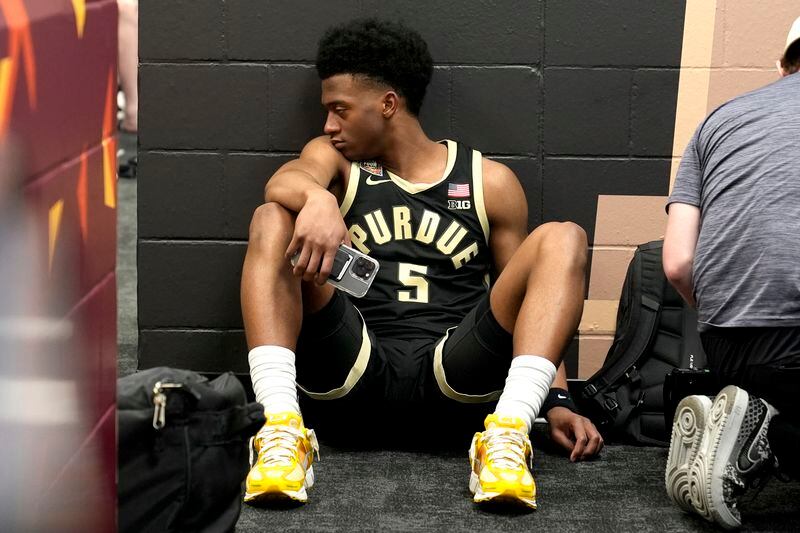 Purdue guard Myles Colvin sits in the locker room after the NCAA college Final Four championship basketball game against UConn, Monday, April 8, 2024, in Glendale, Ariz. (AP Photo/Brynn Anderson)