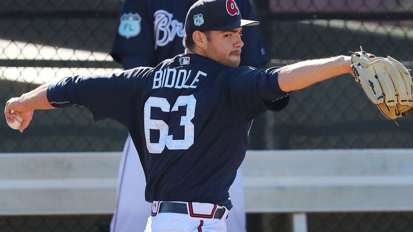 Jesse Biddle, pictured during spring training, got the win in his major league debut Saturday, eight years after he was a first-round draft pick. (Curtis Compton/ccompton@ajc.com)