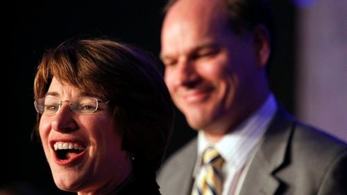 U.S. Senator Amy Klobuchar, D-Minn., speaks at an election night event accompanied by husband John Bessler, right, at the Crowne Plaza, Tuesday, Nov. 6, 2012, in St. Paul, Minn. When the 113th Congress convenes next year, one of every five members of the Senate will be women.