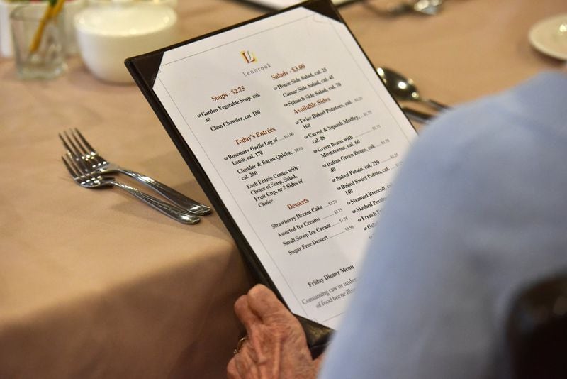 When Lenbrook opened in 1983, it had just one dining room where residents filled out an order ticket with their dinner choices. Now residents choose their meals from menus and place their orders with members of the wait staff. HYOSUB SHIN / HSHIN@AJC.COM