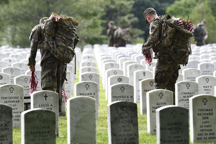 Soldiers place flags at Arlington National Cemetery for Memorial Day