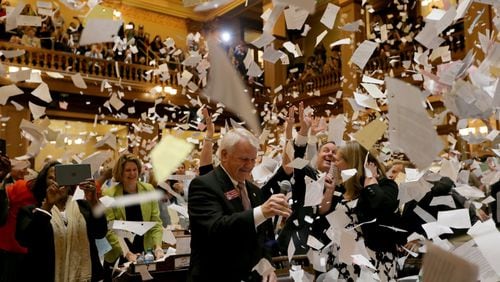 House Majority Leader Jon Burns, R-Newington, is surrounded by flying paper after moving that the House adjourn Sine Die in the early morning hours Friday to end the Legislative session. The House declined to vote on a bill changing DeKalb’s form of government. Ben Gray / bgray@ajc.com