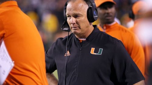 Miami Hurricanes coach Mark Richt waits out a review  early in what went on to become a three-point loss to Virginia. (Ryan M. Kelly/Getty Images)