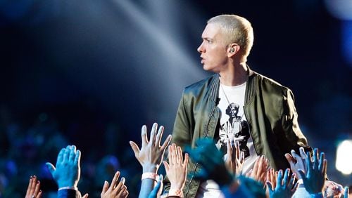 Recording artist Eminem performs onstage at the 2014 MTV Movie Awards at the Nokia Theatre in Los Angeles on April 13, 2014.
