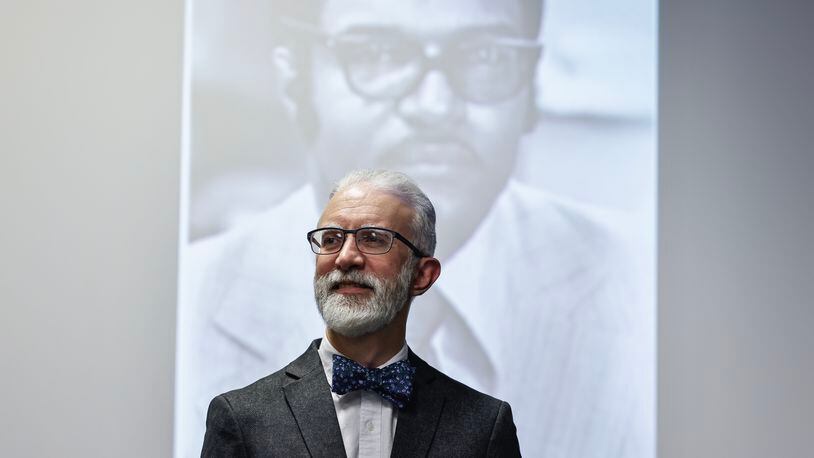 Dr. Mark Smith stands in front of a projected photo of John Blassingame inside of Bond Building at Fort Valley State University on Friday, January 20, 2023.  (Natrice Miller/natrice.miller@ajc.com) 
