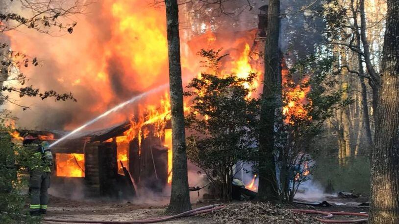 Photos of the blaze shared by the sheriff's office showed the log cabin completely engulfed in flames.
