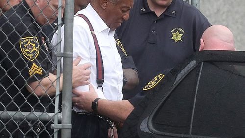 Entertainer Bill Cosby is escorted from the Montgomery County courthouse in Norristown, Pa., on Tuesday, Sept. 25, 2018. Cosby, 81, was sentenced to three-to-10 years in prison. DAVID MAIALETTI / PHILADELPHIA INQUIRER / TNS