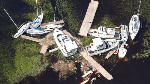 Boats along with sections of dock are scattered in the marsh, some sitting on the bottom, after Hurricane Irma on Tuesday at St. Marys on the Georgia coast. Curtis Compton/ccompton@ajc.com