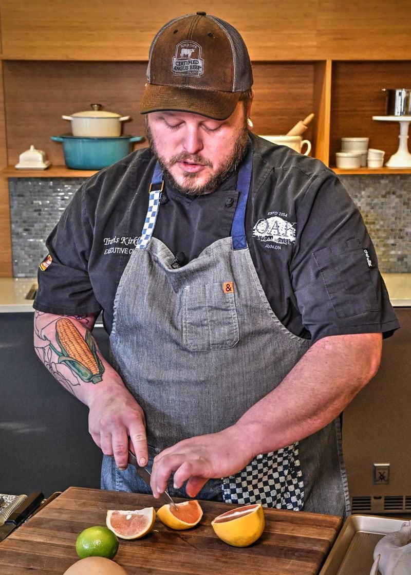 Executive chef Travis Kirkley of Oak Steakhouse in Alpharetta uses a serrated knife to cut a grapefruit. CONTRIBUTED BY CHRIS HUNT PHOTOGRAPHY