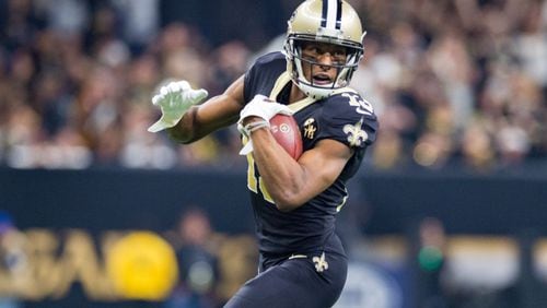 Michael Thomas of the Saints runs the ball during the NFC Championship Game against the Rams.