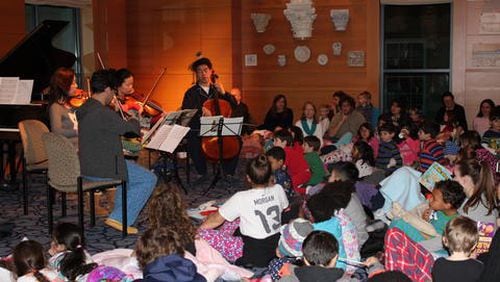 Children enjoy chamber music at the Carlos Museum.