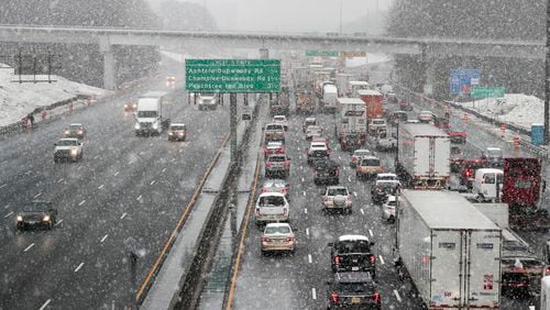 State transportation officials say last Friday's winter storm traffic jam was caused by high traffic volume - not poor road conditions. ALYSSA POINTER/ALYSSA.POINTER@AJC.COM