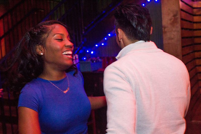 Davina Mackey laughs during a salsa dancing lesson at Loca Luna in Atlanta recently. CONTRIBUTED BY REANN HUBER