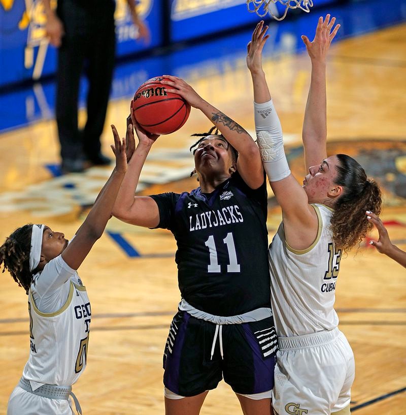 Stephen F. Austin forward Avery Brittingham (11) scores past Georgia Tech forward Lorela Cubaj, (13), during the first half of their first-round  game in the women's NCAA Tournament Sunday, March 21, 2021, at the Greehey Arena in San Antonio, Texas. (Ronald Cortes/AP)