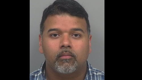 Agie Abraham George, 38, has been charged with battery and kidnapping.