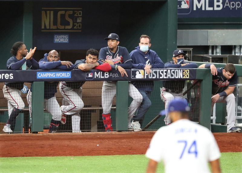 Braves watch from the dugout as pitcher Kenley Jansen closes them out in the 9th inning, falling to the Dodgers 3-1 in game 6 of the National League Championship Series on Saturday, Oct 17, 2020 in Arlington.   “Curtis Compton / Curtis.Compton@ajc.com”