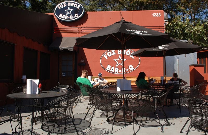 You can dine on a semi-covered patio at Fox Bros. Bar-B-Q on DeKalb Avenue. Becky Stein for The Atlanta Journal-Constitution