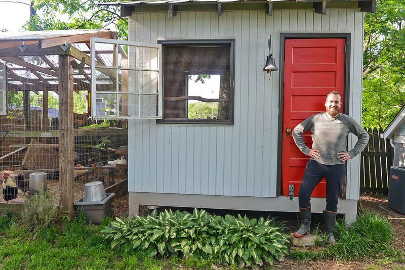 Andy McKeegan stands in front of his chicken coop in his backyard in Atlanta's Kirkwood neighborhood. Andy is a real estate agent for Keller Williams Realty Atlanta Intown.