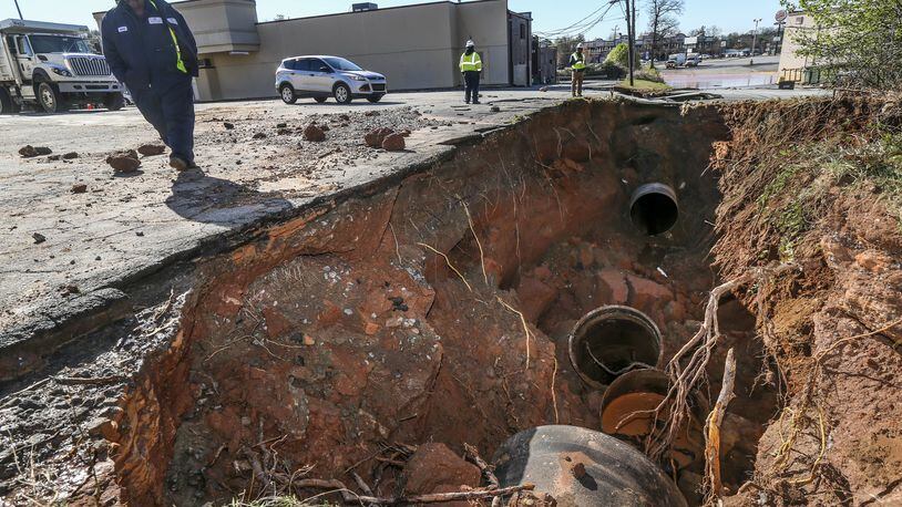 A lawsuit filed by a former DeKalb County procurement officer is another mark against its beleagured water and sewer operations. On March 7, 2018, a water main break along Buford Highway crippled the county’s water supply. JOHN SPINK/JSPINK@AJC.COM