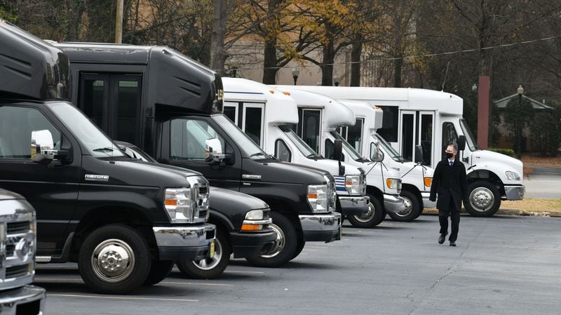 December 31, 2020 Atlanta - Eric Alimena, CEO of Alimena Limousine & Worldwide Transportation, walks past buses parked at his company on Thursday, December 31, 2020. (Hyosub Shin / Hyosub.Shin@ajc.com)