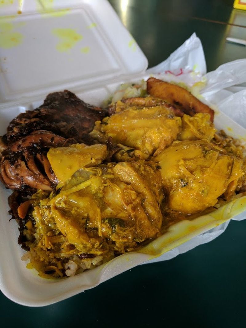 This two-meat combo from Caribbean restaurant Jamaica Cove in Hapeville features jerk chicken and curry chicken. CONTRIBUTED BY PAULA PONTES