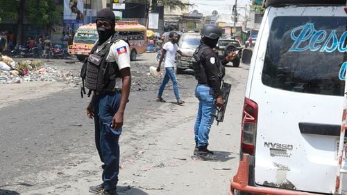 National Police patrol an intersection amid gang violence in Port-au-Prince, Haiti, Monday, April 8, 2024. (AP Photo/Odelyn Joseph)