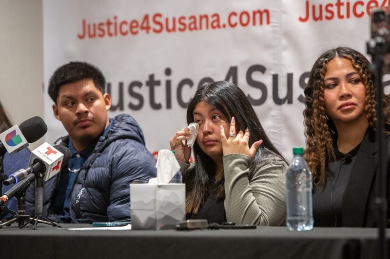 The Morales family, including Susana Morales’ sister Jasmine Morales, center, Brian Perez, Jasmine’s husband left, and supporters of murdered 16-year-old Susana Morales, including Chloë Cheyenne, right, the CEO of CommunityX, participate in a press conference Thursday, March 9, 2023 at the Crowne Plaza Hotel in Norcross asking for more transparency from the Gwinnett County Police and changes in the 48-hour rule imposed when teens go missing.   (Jenni Girtman for The Atlanta Journal-Constitution)
